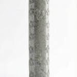Handcrafted Jerusalem stone mezuzah with floral motifs, Hebrew script, and decorative details, on a white studio background with subtle reflection.