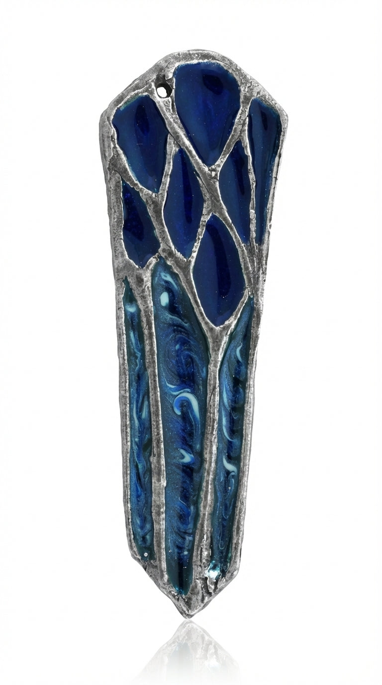 Hand-painted blue lacquer forest scene on pewter mezuzah with Hebrew inscription, designed by Emanuel, showcased on a white studio background with subtle reflection.