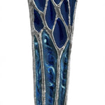 Hand-painted blue lacquer forest scene on pewter mezuzah with Hebrew inscription, designed by Emanuel, showcased on a white studio background with subtle reflection.