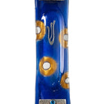 Elegant fused-glass Mezuzah with blue and gold circles, textured silver accents at top and bottom, displayed on a white studio background with soft reflection.