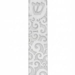 High-resolution image of a metal Gale Mezuzah with elegant swirl design, mounted outdoors with double-sided tape, showcasing fine details and craftsmanship.