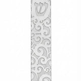 High-resolution image of a metal Gale Mezuzah with elegant swirl design, mounted outdoors with double-sided tape, showcasing fine details and craftsmanship.