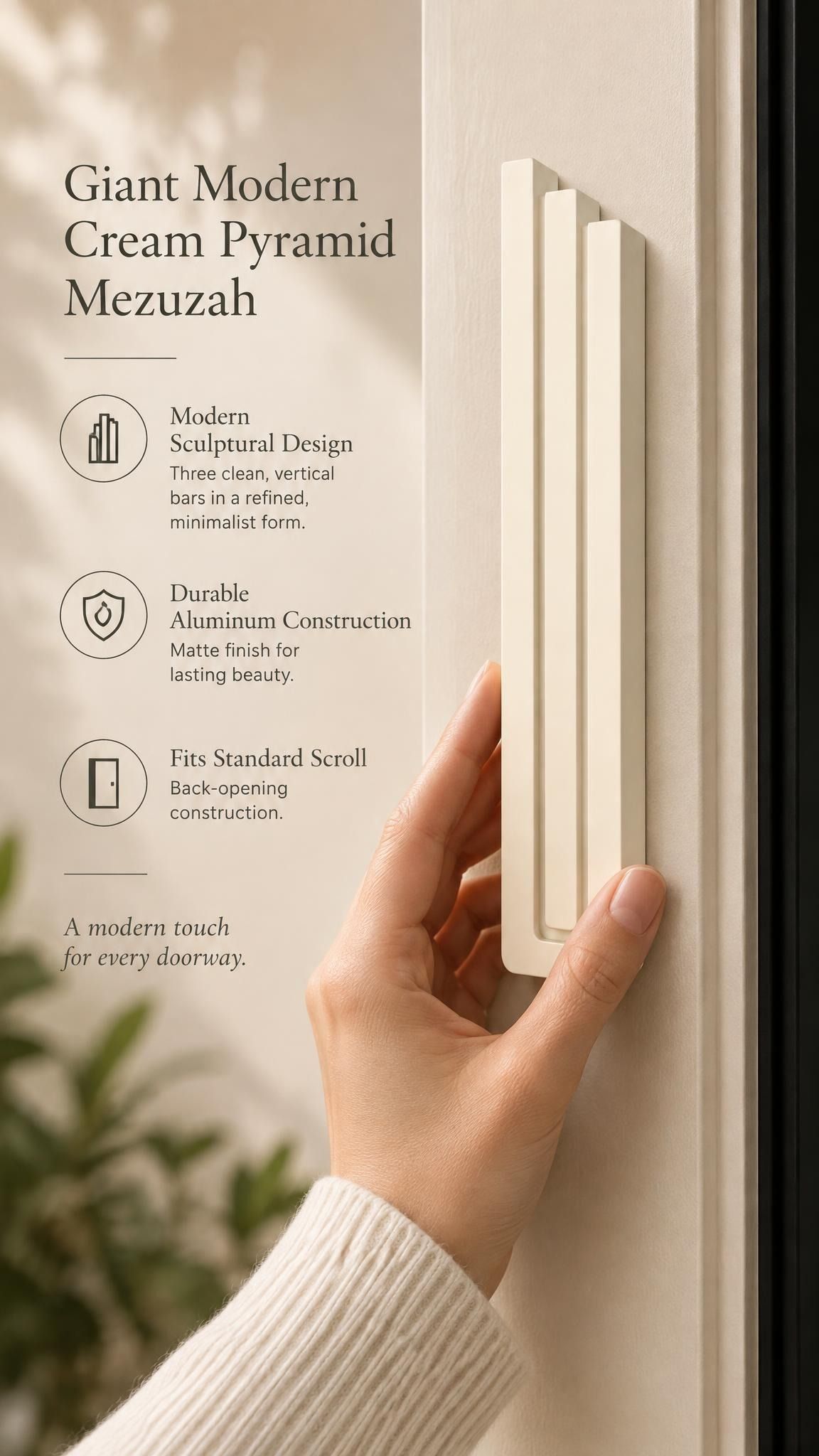Giant Modern Cream Pyramid Mezuzah held beside a doorpost, with the warm ivory cream aluminum mezuzah cover shown close enough to reveal its three stepped bars and rounded lower edge alongside product-name and design callouts for this contemporary Judaica piece