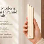 Giant Modern Cream Pyramid Mezuzah pictured in hand as a warm ivory cream aluminum mezuzah cover with three graduated bars and a contemporary stepped design, alongside its name and illustrated product features in a wide social-sharing image
