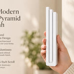 Giant Modern White Pyramid Mezuzah pictured in hand as a smooth matte white aluminum mezuzah cover with three graduated bars and a architectural stepped design, alongside its name and illustrated product features in a wide social-sharing image