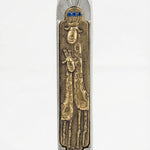 Elegant Giraffe Mezuzah made of pewter and brass, 5 inches tall, with Hebrew engravings, mounted on a white studio background with soft reflection.