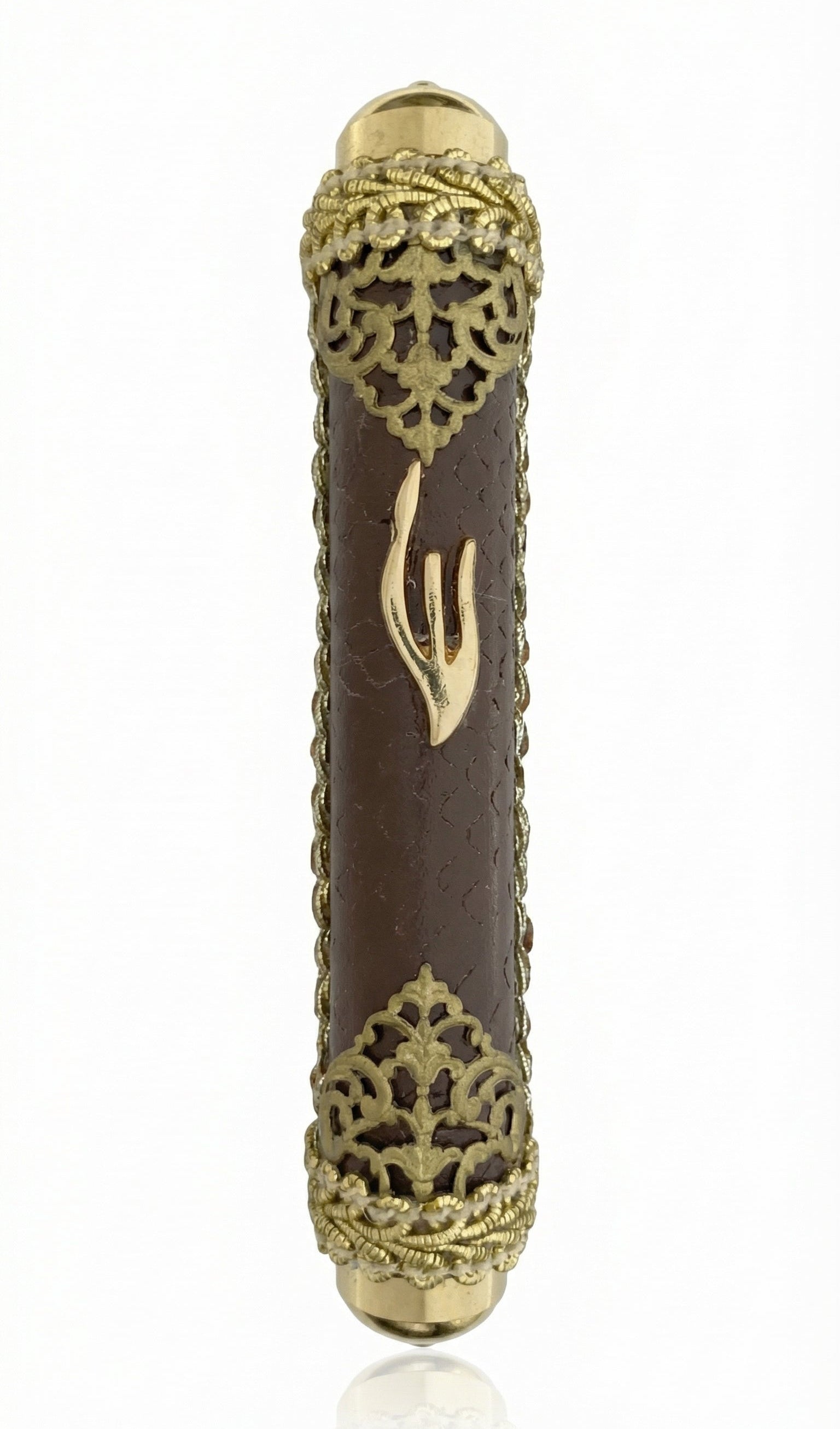 Gold and brown leather mezuzah case with brass filigree and a Shin symbol, made in Israel.