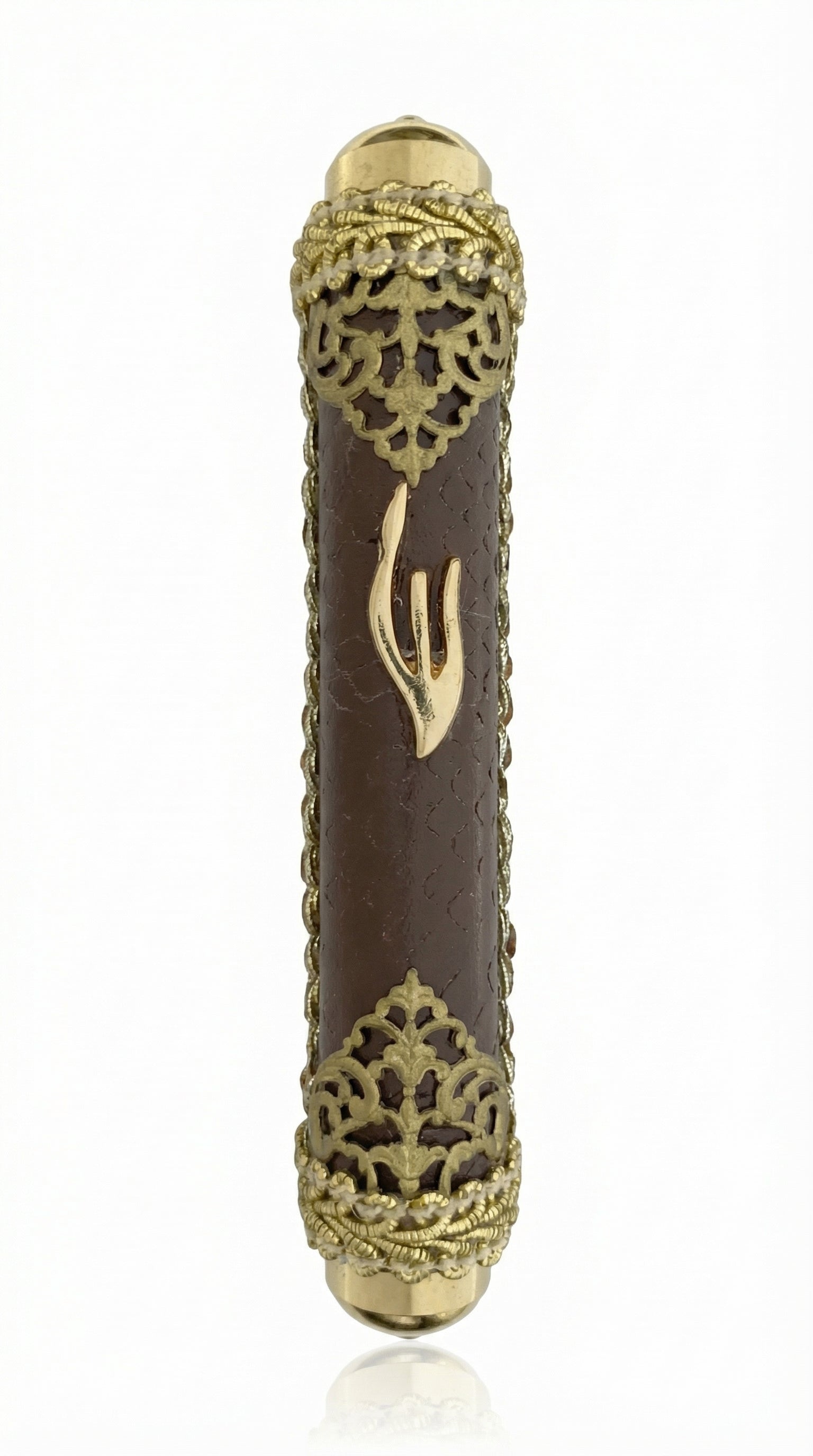 Gold and brown leather mezuzah case with brass filigree and a Shin symbol, made in Israel.