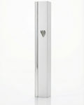 Gold mezuzah with intricate carvings and Hebrew inscriptions against a bright white background with soft reflection