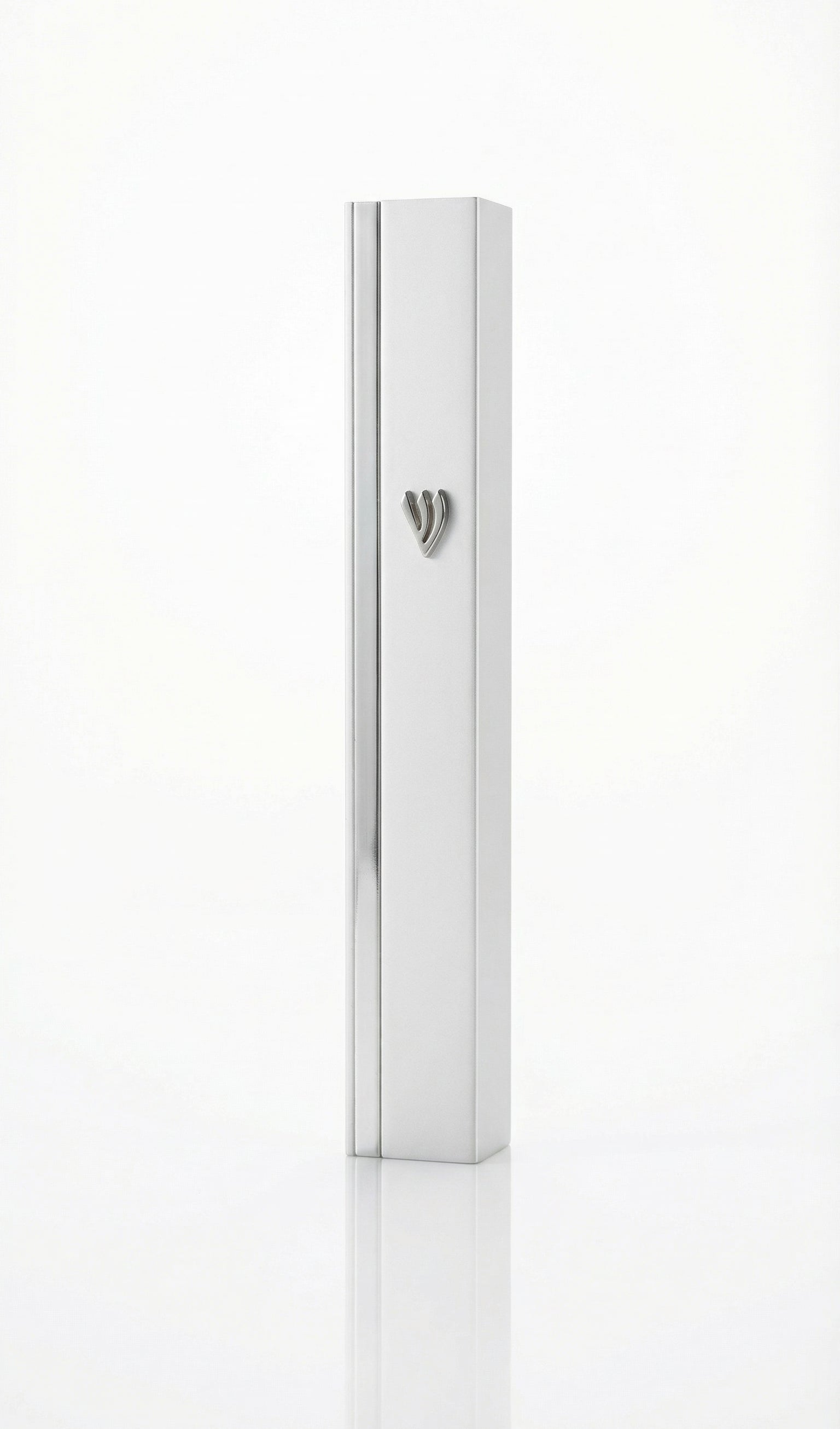 Gold mezuzah with intricate carvings and Hebrew inscriptions against a bright white background with soft reflection