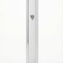 Gold mezuzah with intricate carvings and Hebrew inscriptions against a bright white background with soft reflection