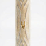 Handcrafted Golden Arch Mezuzah made from Jerusalem stone, showcasing natural variations, intricate engravings, and decorative motifs on a white studio background.