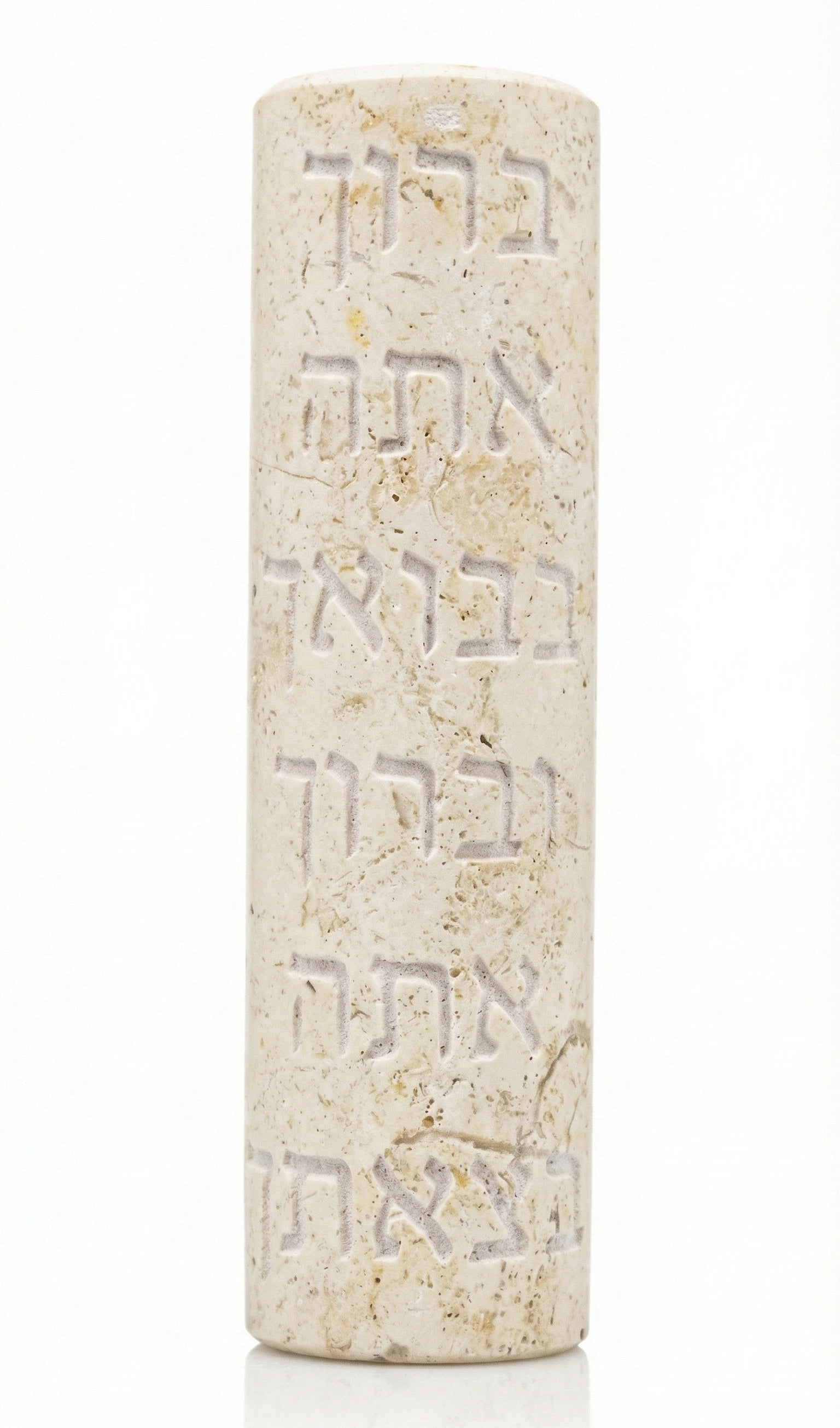 Elegant Jerusalem stone mezuzah with Hebrew blessing, handcrafted in Israel, featuring intricate surface details and natural color variations.