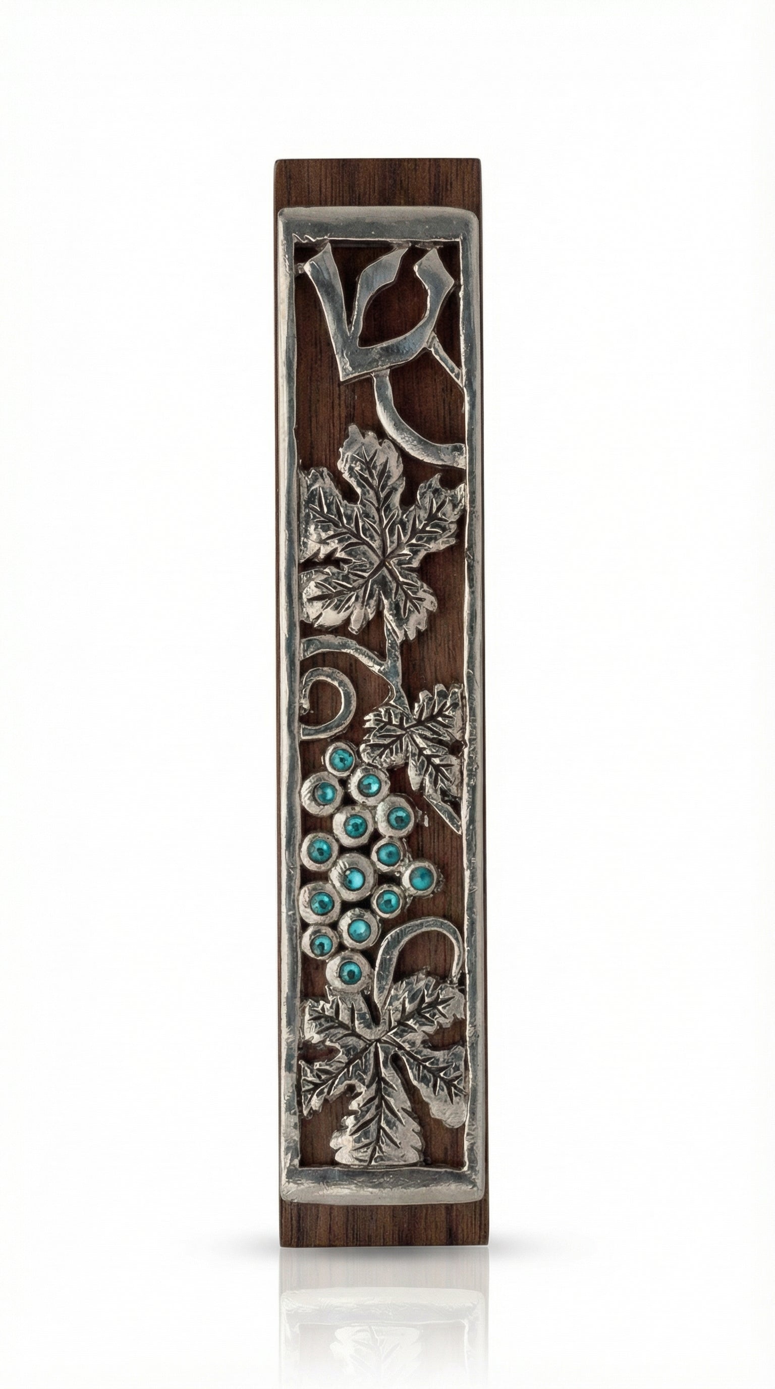 Mahogany mezuzah with curling pewter vine and turquoise stones, depicting one of the seven species of the holy land, detailed and crafted with fine finishing.