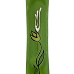Made of glass with intricate floral and Hebrew motifs, green flower mezuzah displayed on a white background with soft reflection.