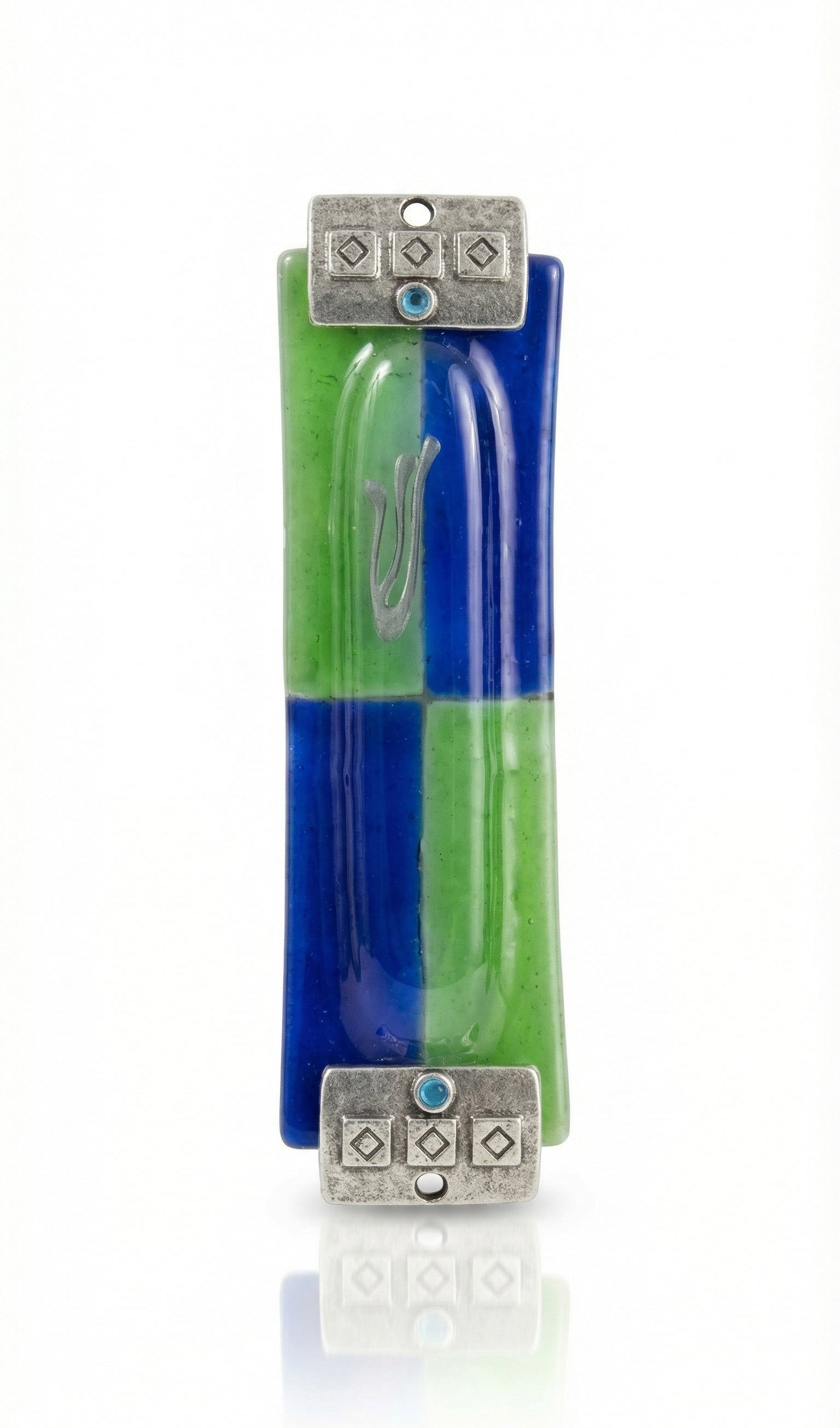 Fused glass Mezuzah in green and blue with silver textured accents, displayed on a white studio background with soft reflection.