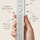 Person holding the Silver Script Glass Mezuzah, emphasizing its design, materials, and mounting details with a minimalist layout.
