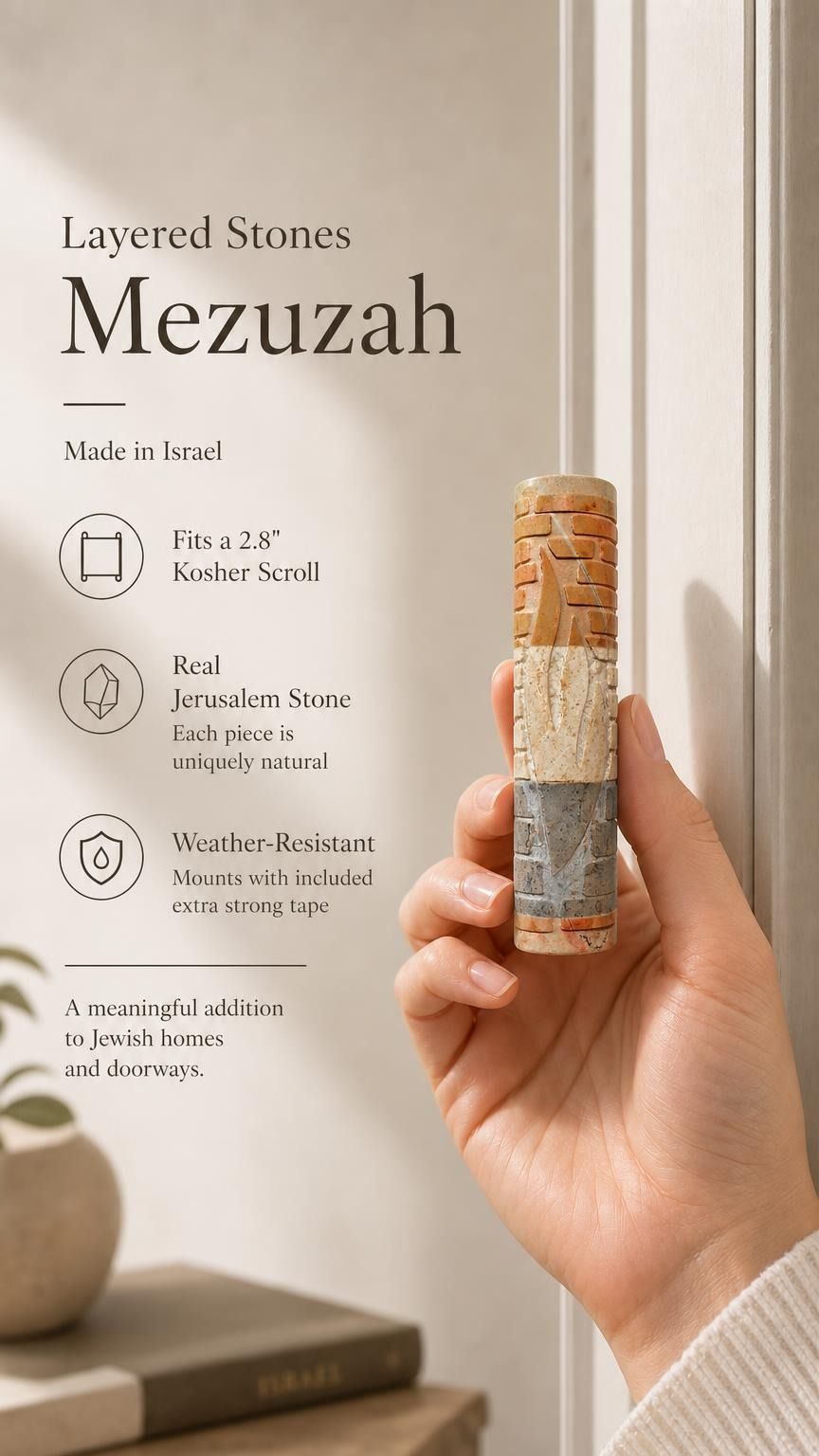 Person holding an authentic Jerusalem stone mezuzah, showcasing its textured layers, natural stone color variation, and meaningful design, in a premium store setting.