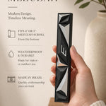 Close-up of person holding the authentic mezuzah with editorial styling, showcasing details and material in a vertical 9:16 format.