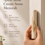 Person holding Jerusalem stone mezuzah showing texture, material, and size for product display.