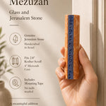 Close-up of a person's hand holding the Jerusalem stone and glass mezuzah, emphasizing its size, material, and craftsmanship for store promotion.