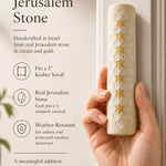 Person holding a handcrafted Jerusalem stone mezuzah, highlighting its authentic texture, size, and material in a premium store presentation.