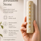 Person holding a handcrafted Jerusalem stone mezuzah, highlighting its authentic texture, size, and material in a premium store presentation.