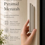 Person naturally holding the exact modern sandstone pyramid mezuzah cover showcasing its design and material.