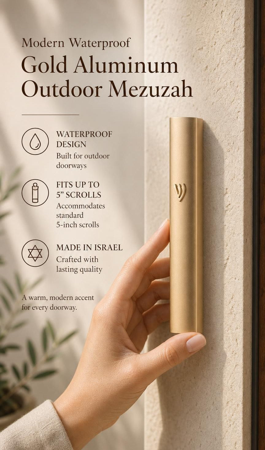 Close-up of a person holding the gold aluminum outdoor mezuzah, with editorial text space on the side, highlighting its elegant simplicity and protective finish.