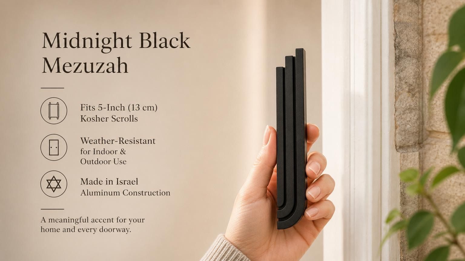 Person holding modern black aluminum mezuzah with three ascending rectangular bars, showing scale and design for door mounting.