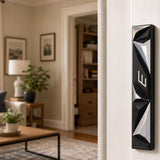 Person holding the Cyber Prism black geometric mezuzah with a natural indoor setting and soft lighting for e-commerce.