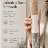 Person holding an extra large natural Jerusalem stone mezuzah case featuring a layered relief design.