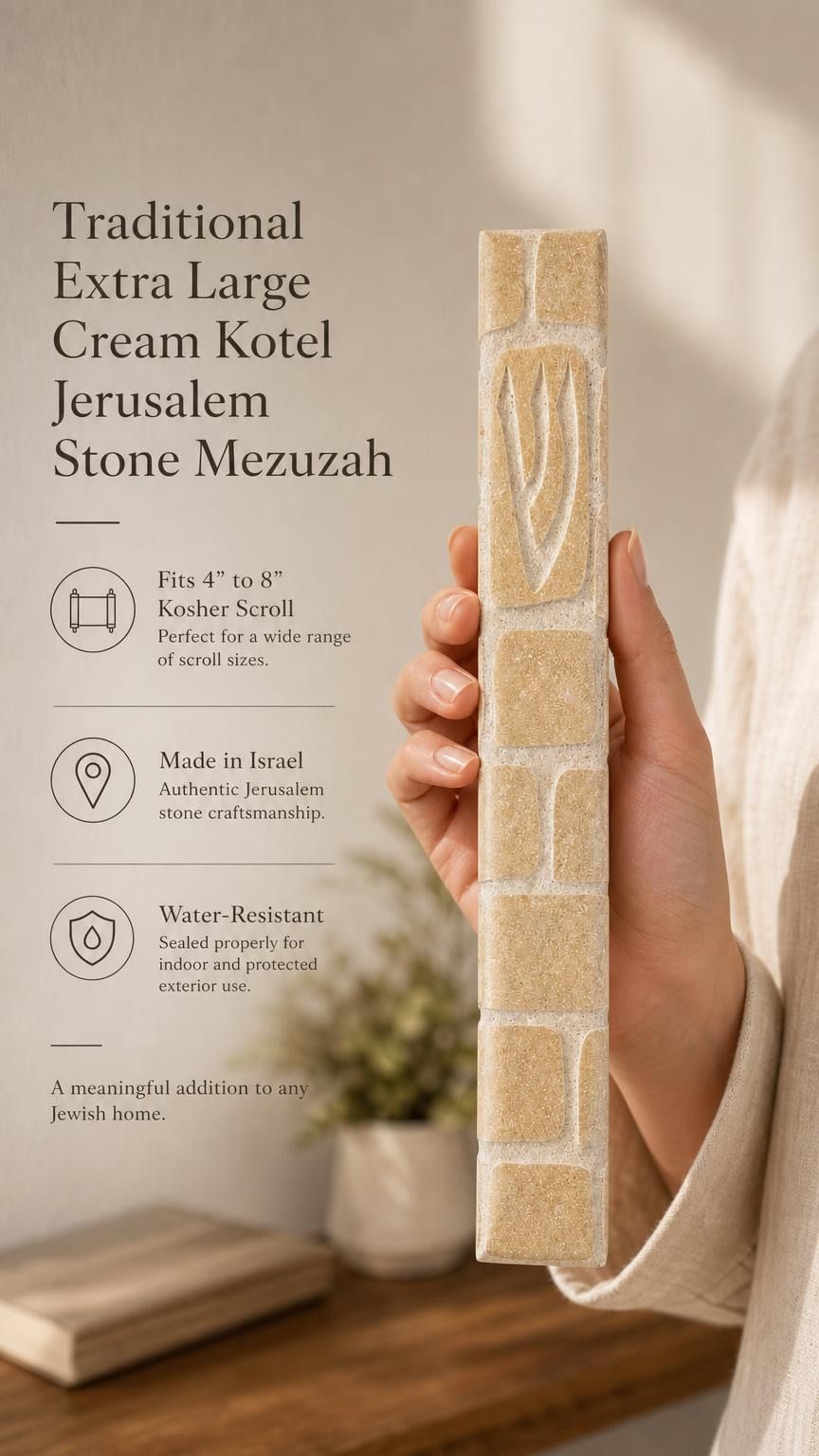 Hand holding the Old City cream Jerusalem stone mezuzah in natural light showing grain and texture.