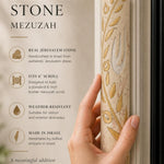 Person holding the large Jerusalem stone mezuzah featuring olive branch and Shin symbol, showcasing natural stone texture and design.