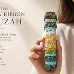 Hand-painted garden ribbon mezuzah with floral design and raised flower details for doorway decoration.