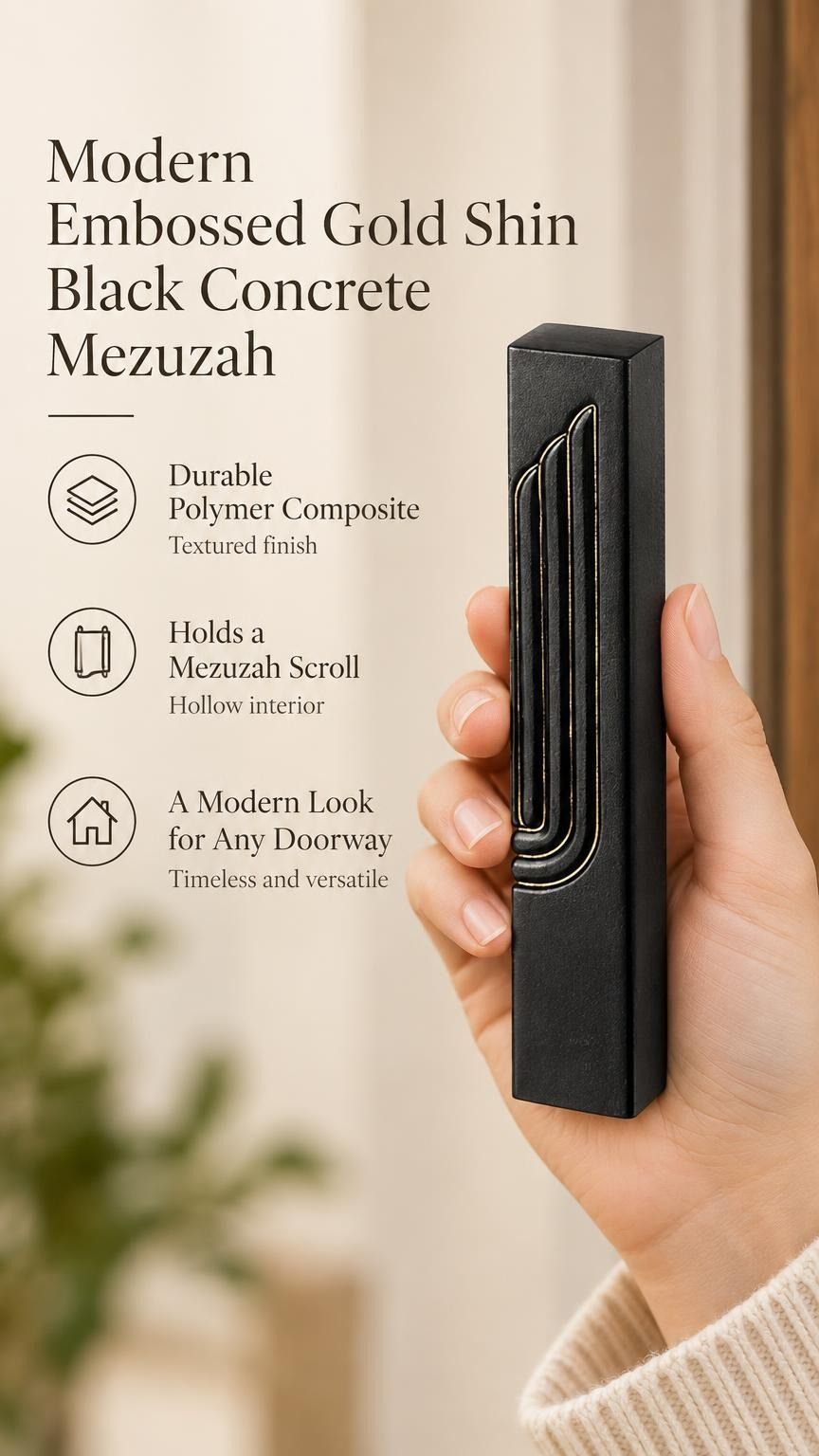 Close-up of a hand holding an embossed black concrete mezuzah case with gold-tone Shin detail against a neutral background.
