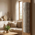 Real Jerusalem stone mezuzah mounted on a doorway, showcasing natural texture and surface characteristics.