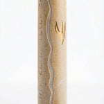 High-resolution image of a handcrafted Jerusalem stone Mezuzah with detailed engraving, texture, and decorative motifs