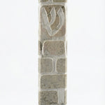 Gray Jerusalem stone mezuzah, handcrafted in Israel, with engraved Hebrew letters and decorative motifs, 5-inch size.