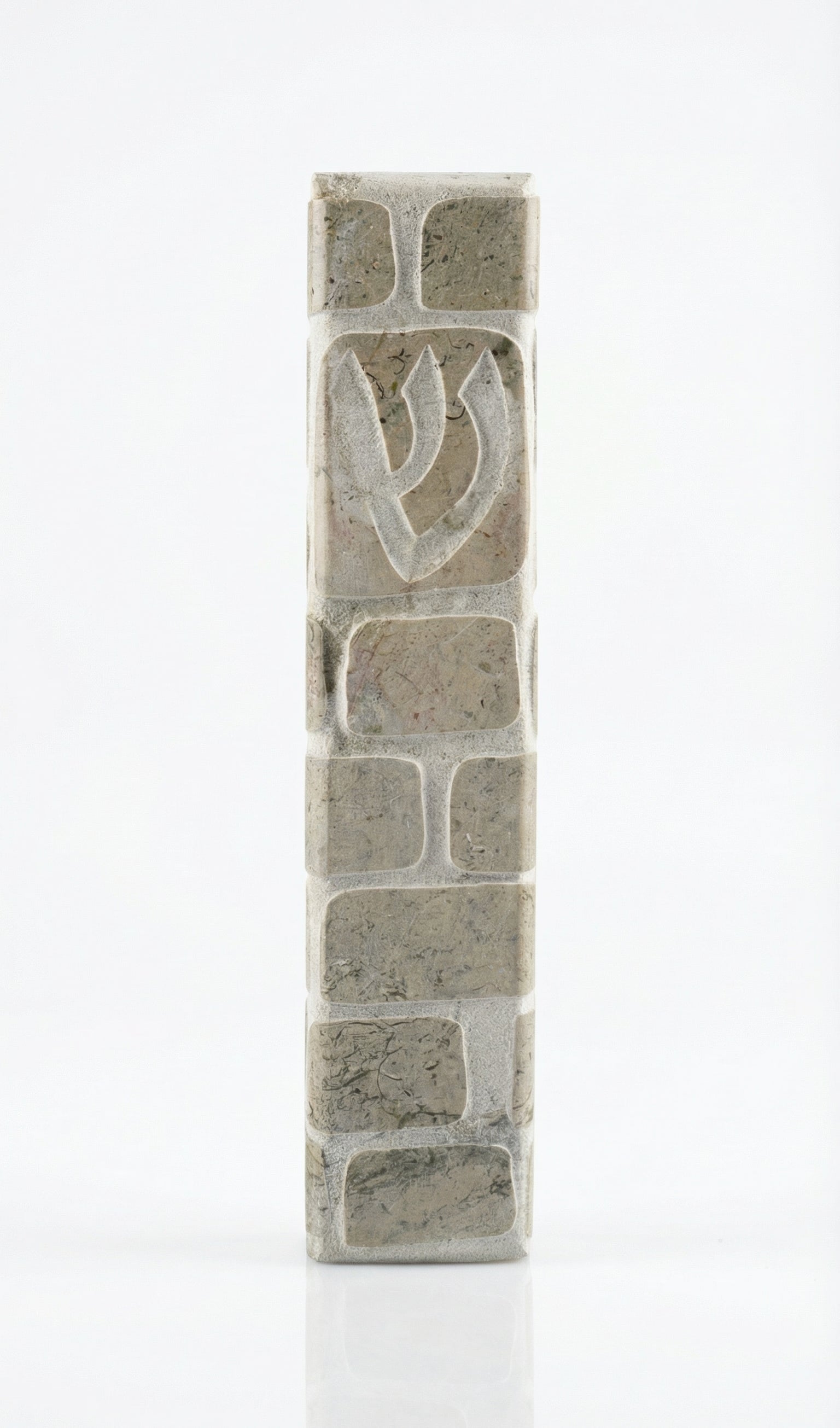 Gray Jerusalem stone mezuzah, handcrafted in Israel, with engraved Hebrew letters and decorative motifs, 5-inch size.