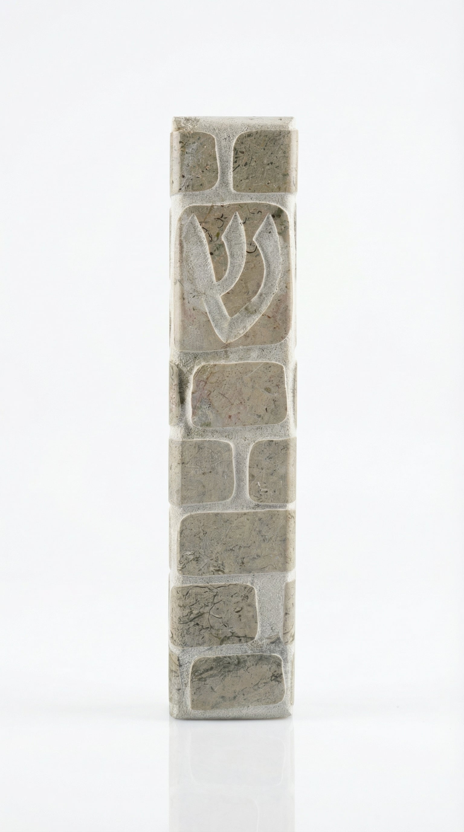 Gray Jerusalem stone mezuzah, handcrafted in Israel, with engraved Hebrew letters and decorative motifs, 5-inch size.