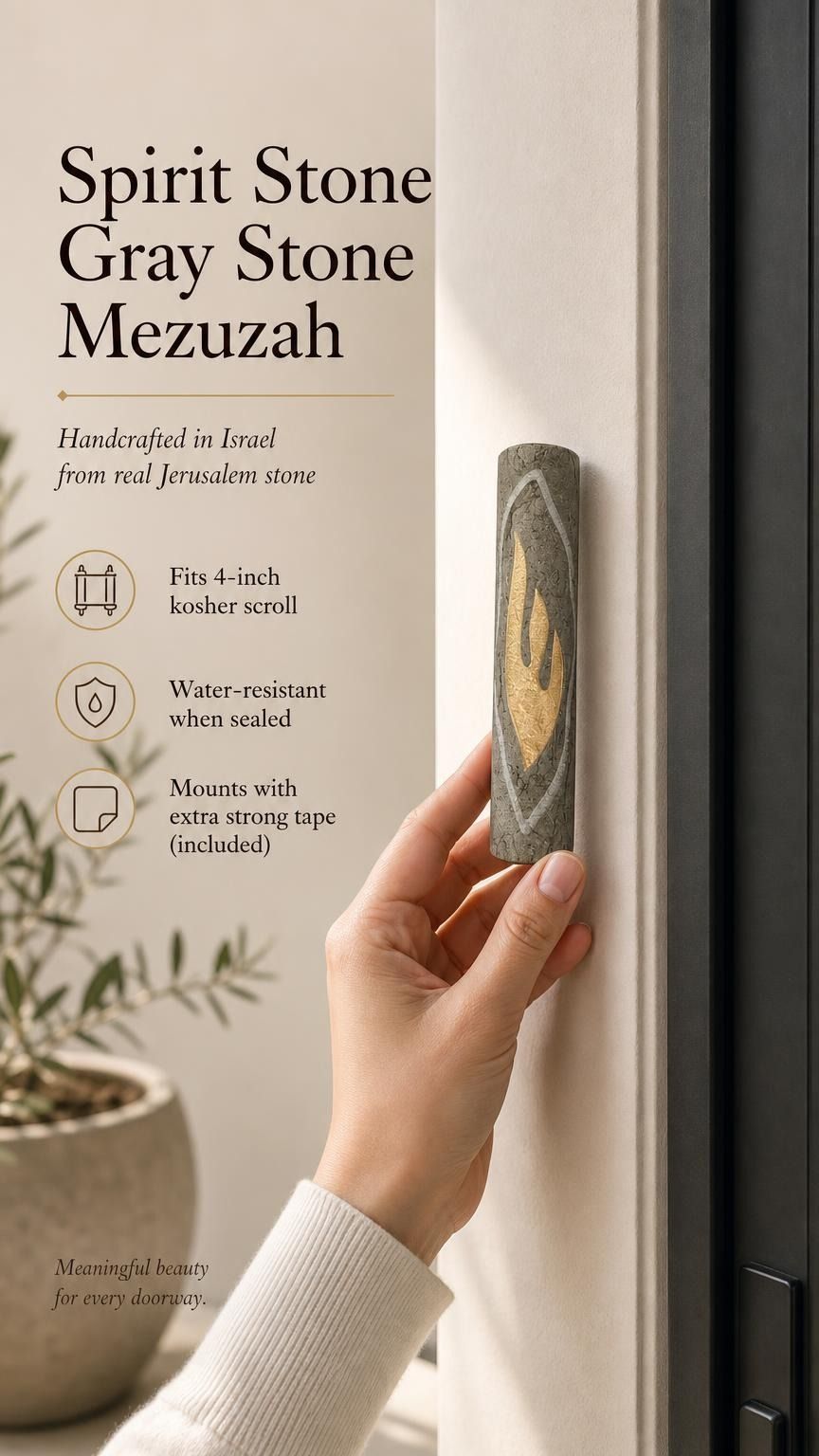Person holding a handcrafted Jerusalem stone mezuzah with a prominent gold Shin letter.