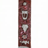 High-resolution image of a pewter mezuzah with enamel, featuring a leaf and Shin Hebrew letter, on a white background with soft reflection.