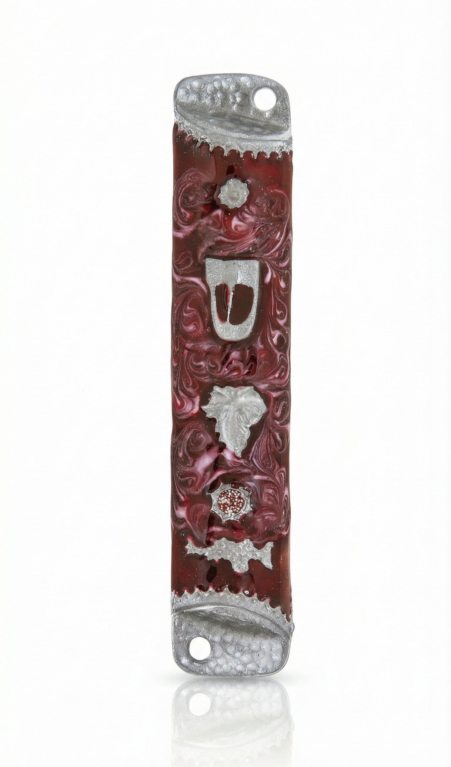High-resolution image of a pewter mezuzah with enamel, featuring a leaf and Shin Hebrew letter, on a white background with soft reflection.