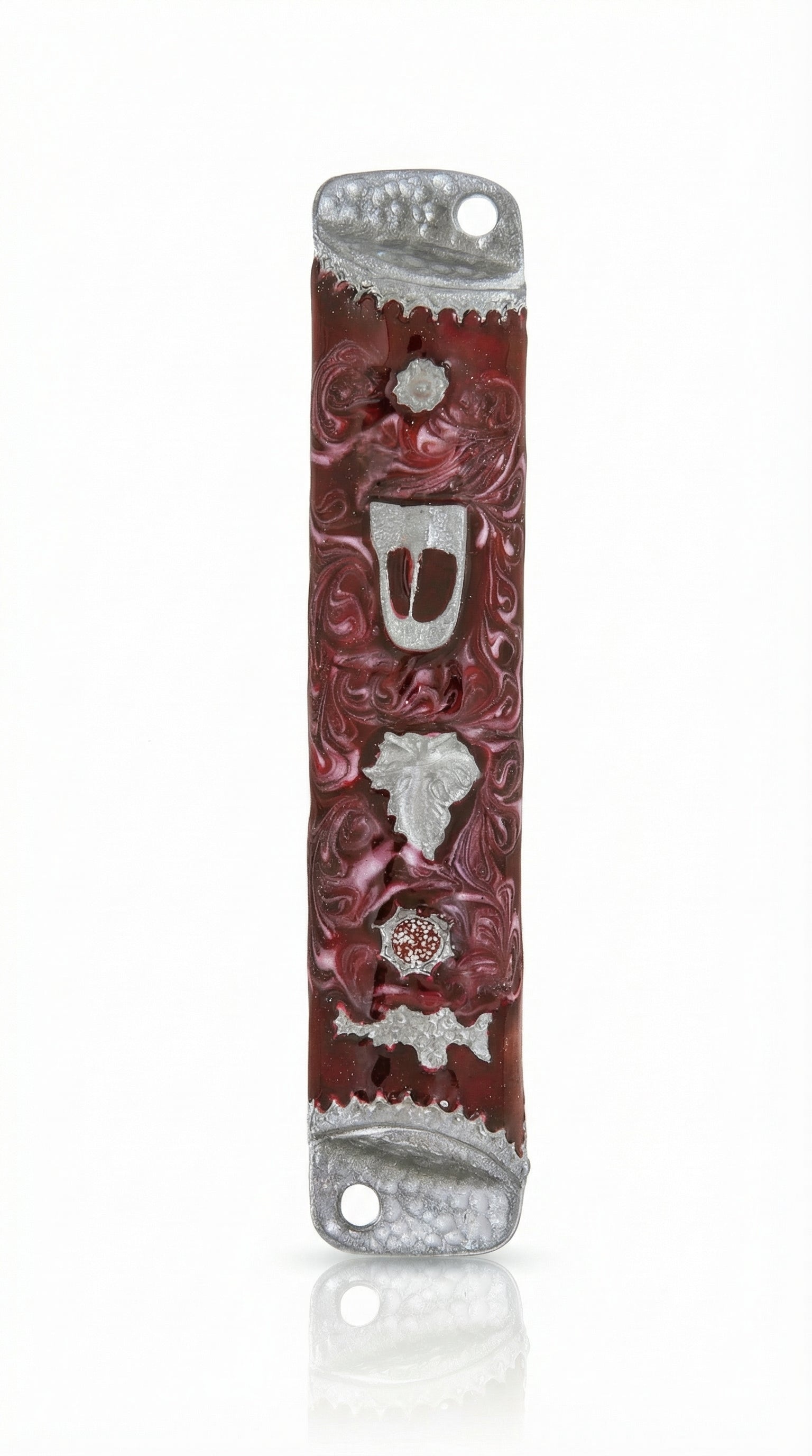 High-resolution image of a pewter mezuzah with enamel, featuring a leaf and Shin Hebrew letter, on a white background with soft reflection.