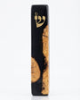 Healing black Mezuzah made of olive wood and resin, with intricate Hebrew engravings, mounted on a white studio background with soft reflection.
