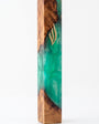 Artistic Olive Wood Emerald Green Resin Mezuzah standing on a white studio background, a handmade Israeli mezuzah case pairing warm olive wood grain with translucent emerald green resin and a gold Shin, made for a 6-inch kosher scroll