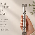Hand-held Heritage Hammered Pewter Mezuzah with textured silver finish and Hebrew scroll band accents