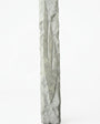 Detailed mezuzah with engraved Hebrew letters and decorative motifs on a pure white background, with a soft reflection below.