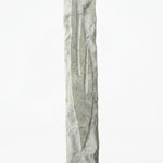 Detailed mezuzah with engraved Hebrew letters and decorative motifs on a pure white background, with a soft reflection below.